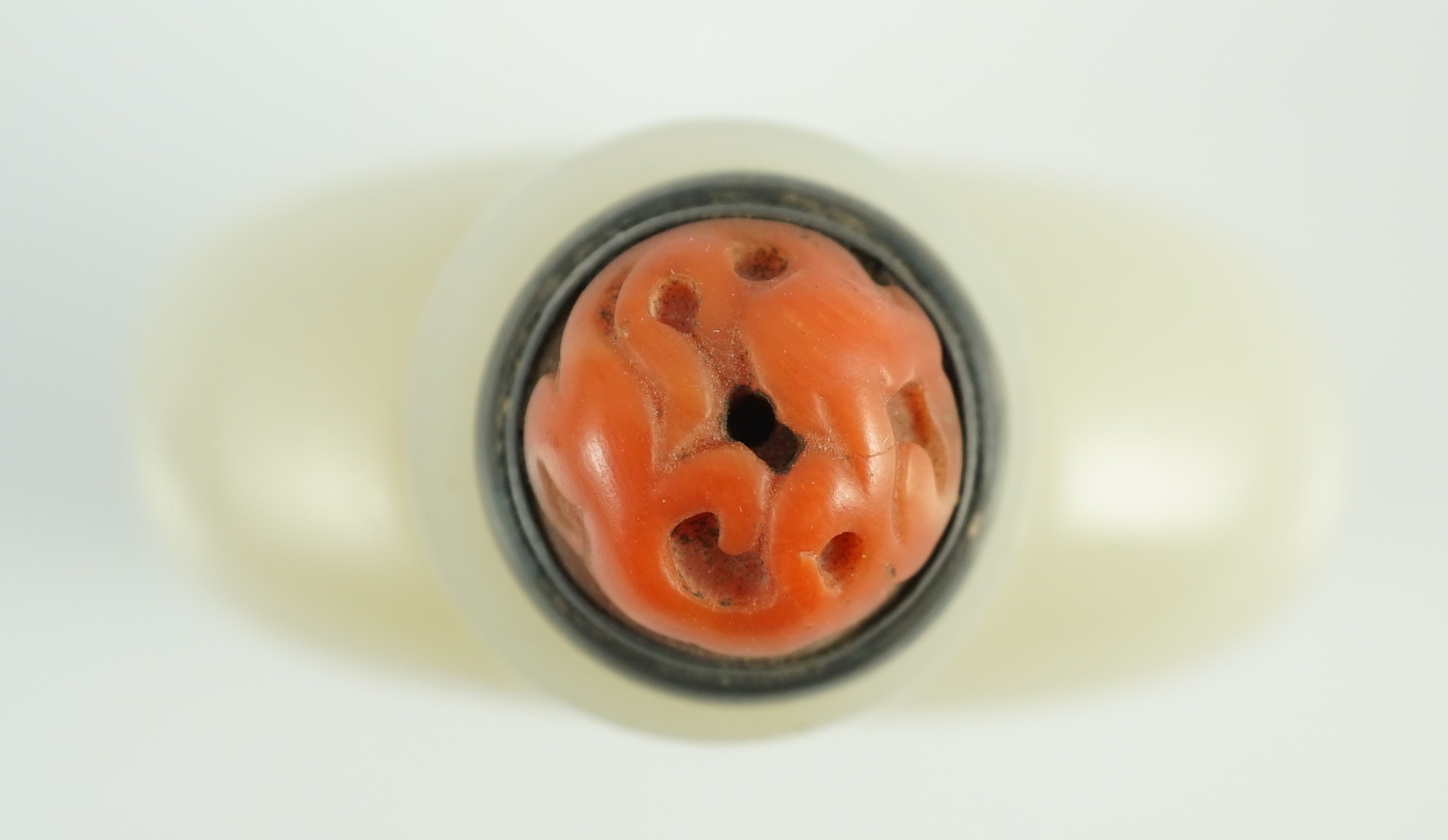 A Chinese inscribed white jade snuff bottle, 19th century, 6.7cm high, metal and coral stopper